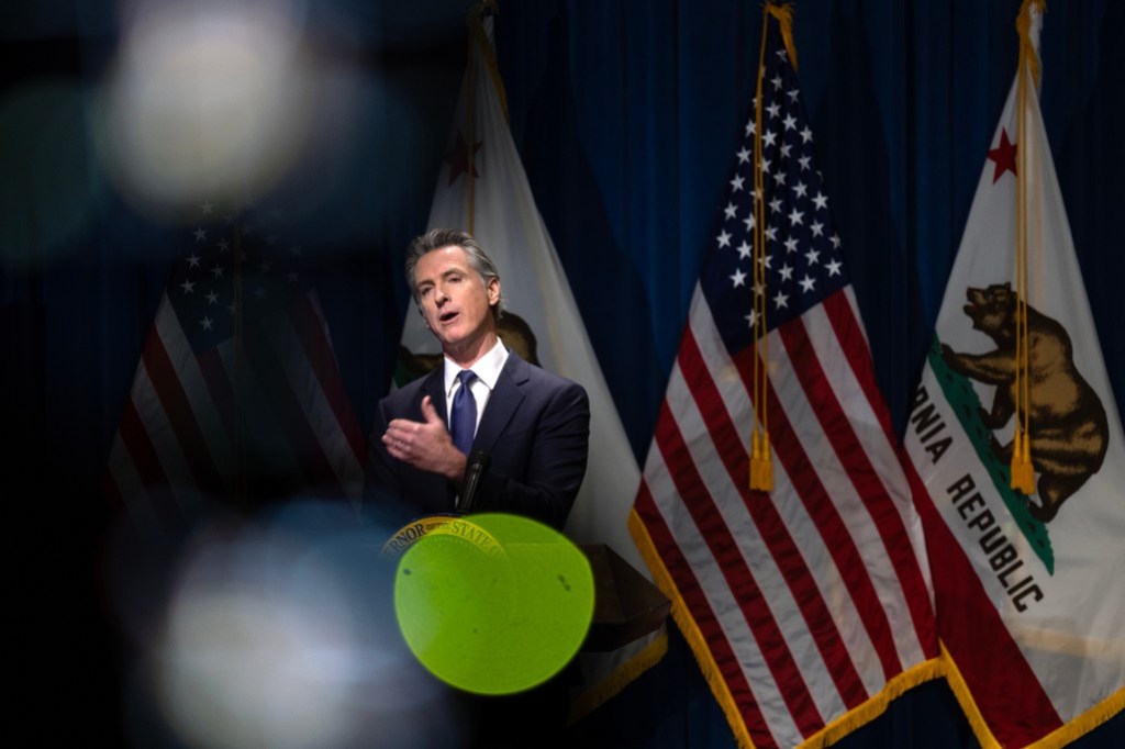 Gov. Gavin Newsom addresses the media during a press conference unveiling his 2024-25 January budget proposal at the Secretary of State Auditorium in Sacramento on Jan. 10, 2024. Photo by Miguel Gutierrez Jr., CalMatters