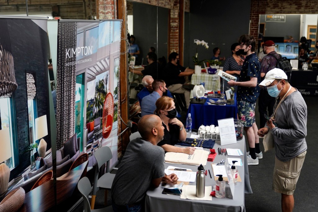 Prospective employers and job seekers interact during during a job fair in the West Hollywood section of Los Angeles on Sept. 22, 2021. Photo by Marcio Jose Sanchez, AP Photo