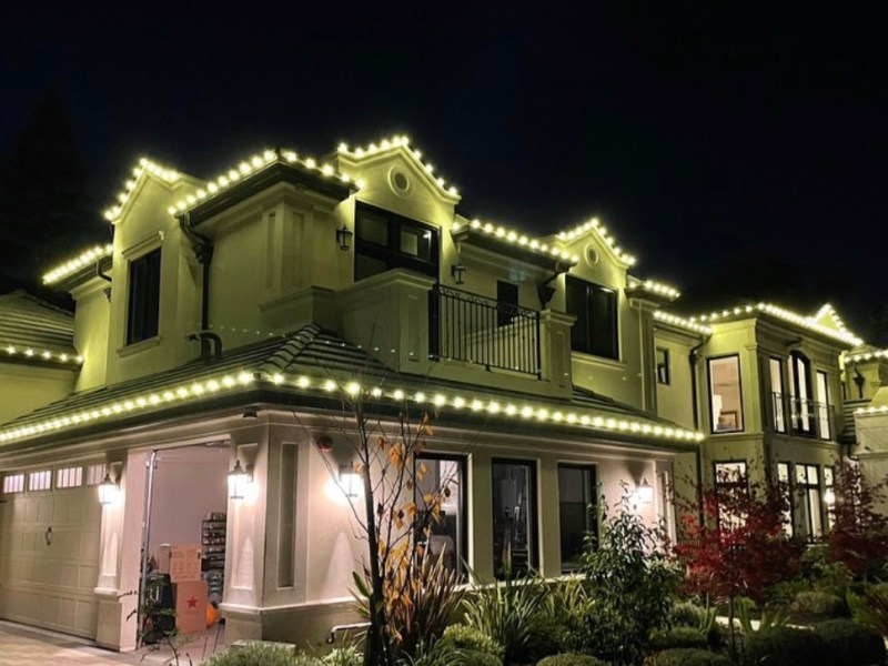 Holiday Lights Inc. decked out this Atherton home with strings of white lights. The company illuminates more than 500 homes in the Bay Area each holiday season. Photo courtesy Holiday Lights Inc.