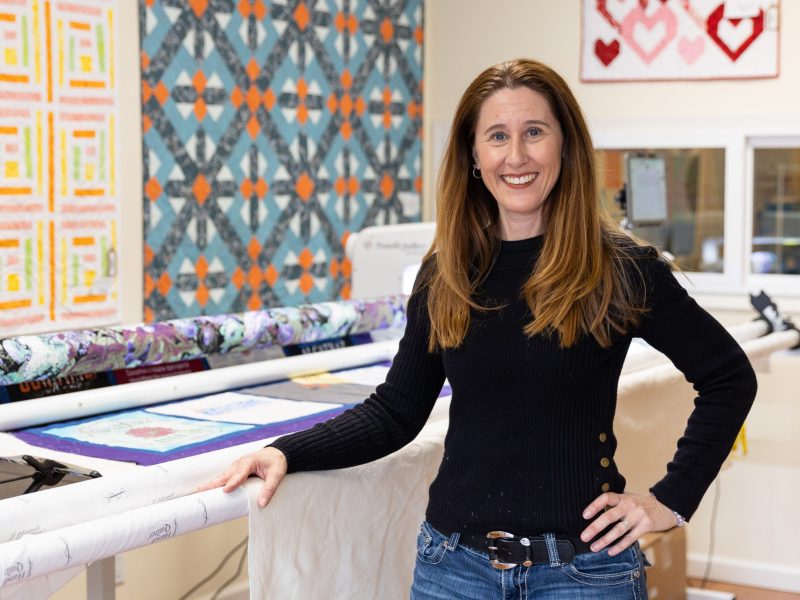 Owner Dana Miller poses for a portrait at Coastside Quilt Studio in Pacifica on Nov. 30, 2023. Photo by Magali Gauthier.